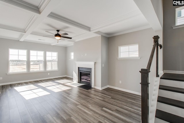 unfurnished living room with coffered ceiling, a fireplace with flush hearth, stairway, dark wood-style floors, and beamed ceiling