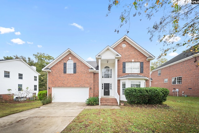 front of property with a garage and a front lawn