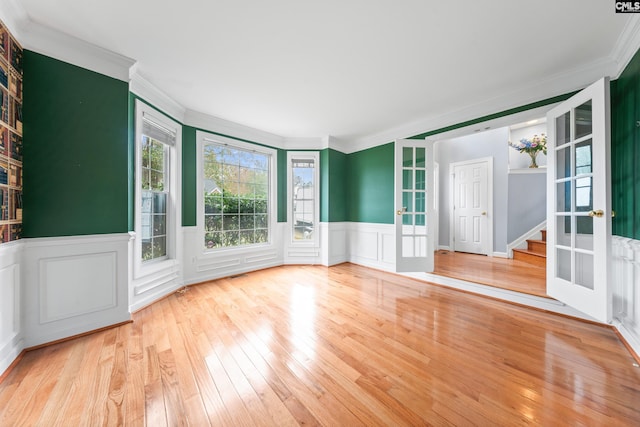 unfurnished sunroom featuring french doors