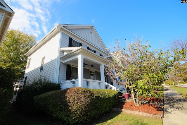 view of property exterior featuring covered porch