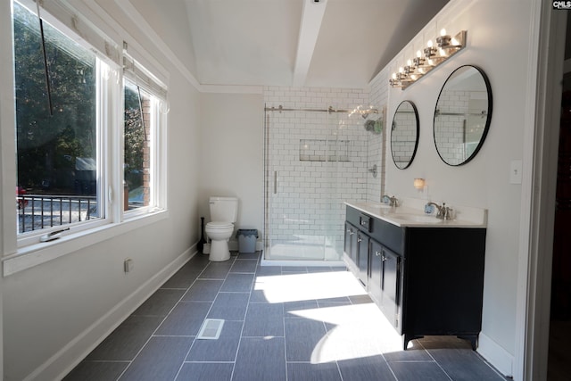 bathroom featuring toilet, a stall shower, a sink, double vanity, and baseboards