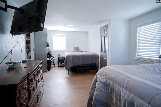 bedroom with light wood-type flooring