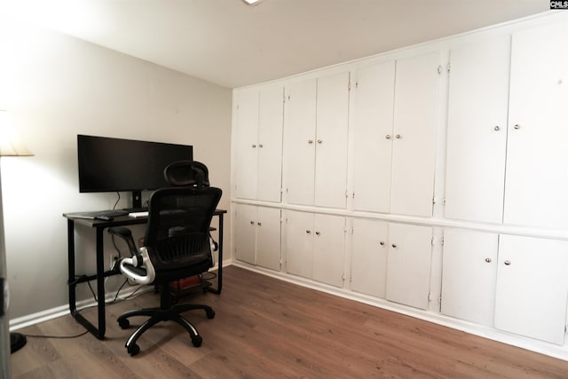 office area featuring baseboards and wood finished floors