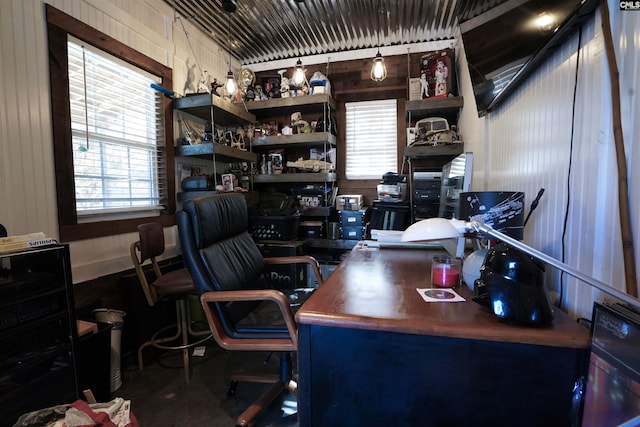 office space with wooden walls and a wealth of natural light