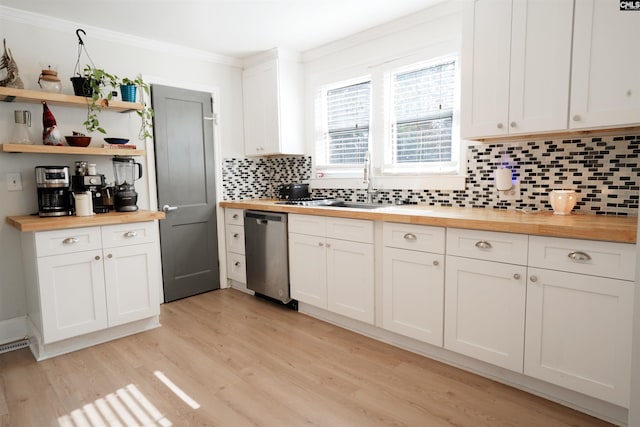 kitchen with tasteful backsplash, butcher block counters, dishwasher, light wood-type flooring, and ornamental molding