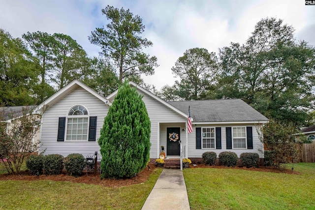 ranch-style home with a front lawn