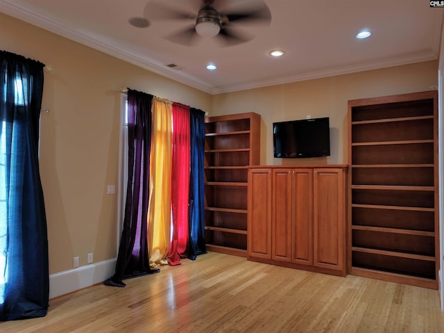 unfurnished living room featuring ceiling fan, light hardwood / wood-style flooring, and crown molding