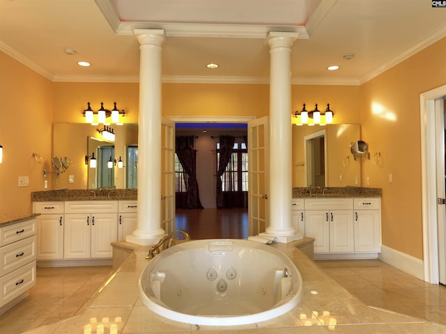 bathroom featuring vanity, tile patterned floors, crown molding, and a relaxing tiled tub