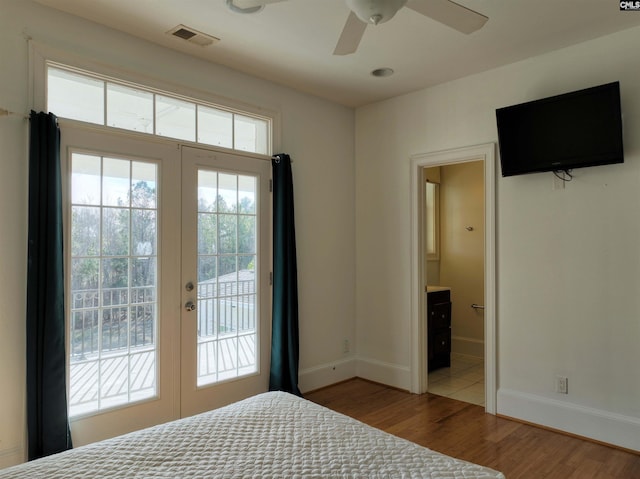 unfurnished bedroom with french doors, ensuite bath, access to exterior, light hardwood / wood-style floors, and ceiling fan