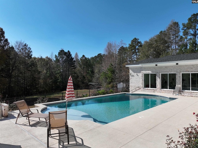 view of swimming pool featuring a patio