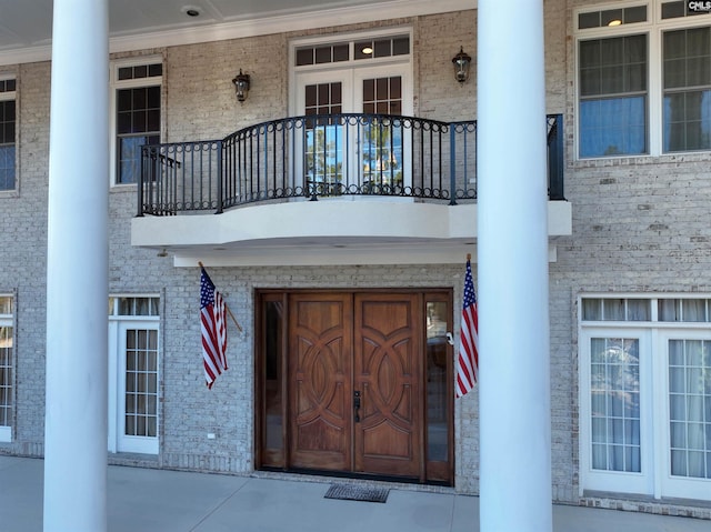 doorway to property featuring a balcony