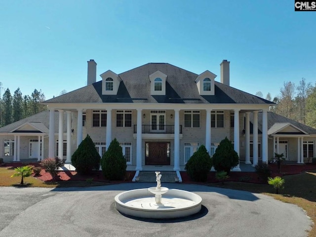 neoclassical / greek revival house with a balcony