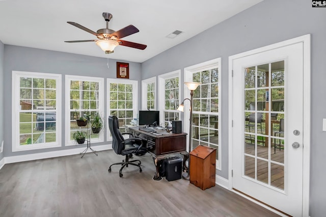 office area featuring ceiling fan, plenty of natural light, and light hardwood / wood-style flooring