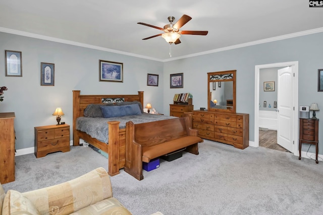 carpeted bedroom featuring ensuite bath, ceiling fan, and crown molding