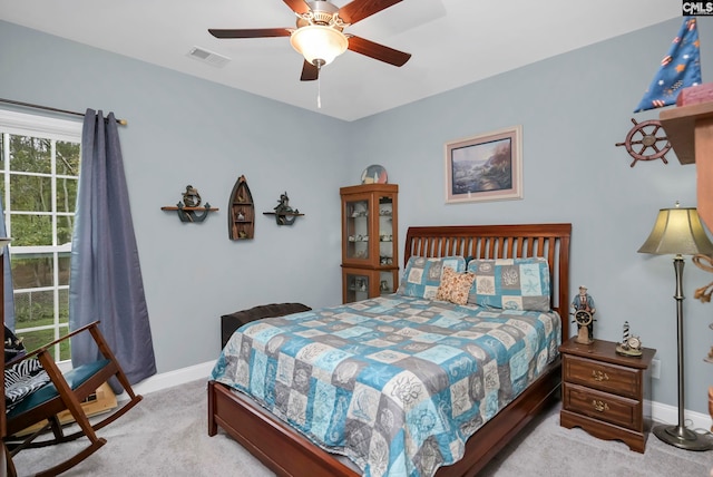 carpeted bedroom with ceiling fan