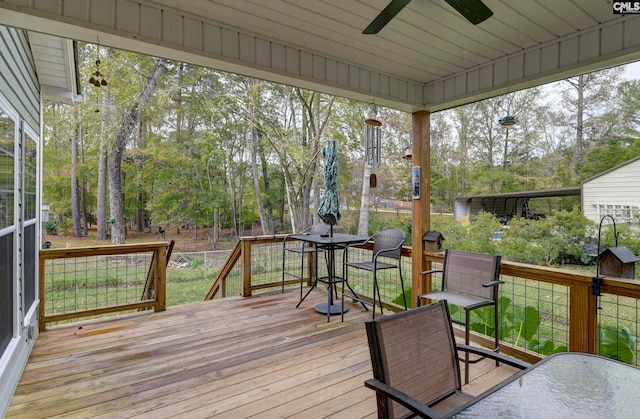 wooden terrace featuring ceiling fan