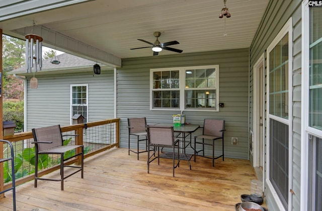 wooden terrace featuring ceiling fan