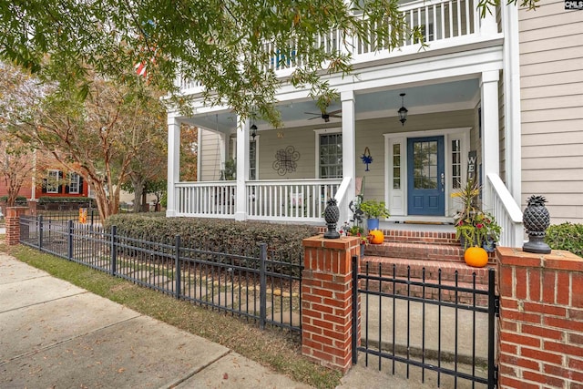 doorway to property featuring a porch and ceiling fan