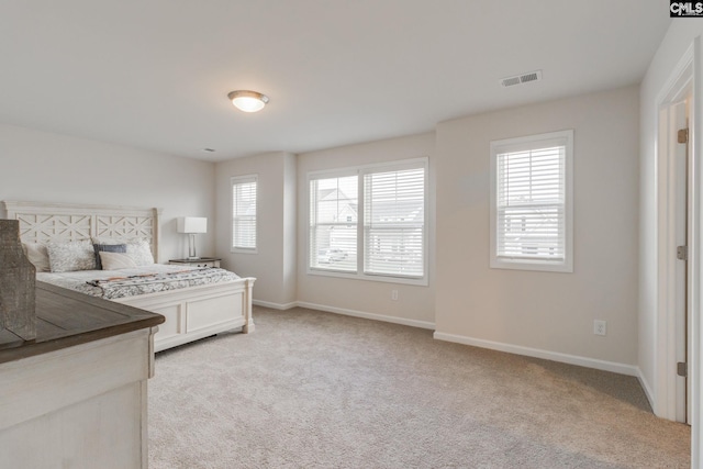 bedroom with light carpet