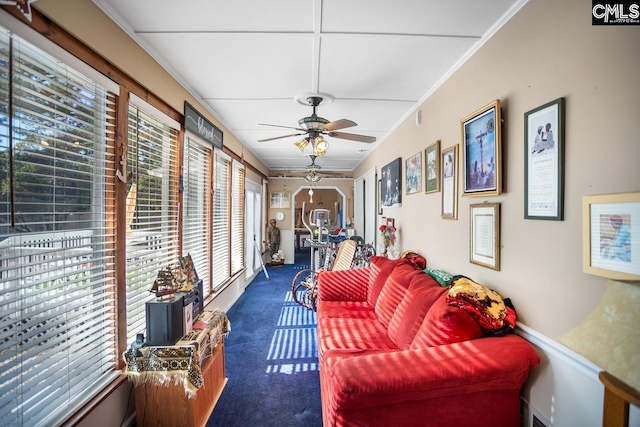 sunroom with ceiling fan