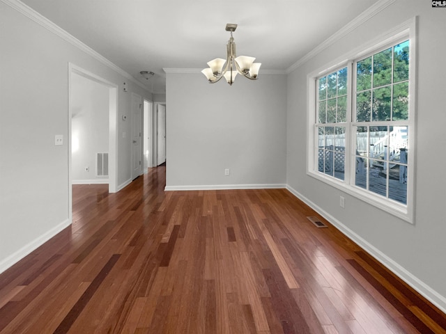 unfurnished dining area featuring an inviting chandelier, dark hardwood / wood-style floors, and crown molding