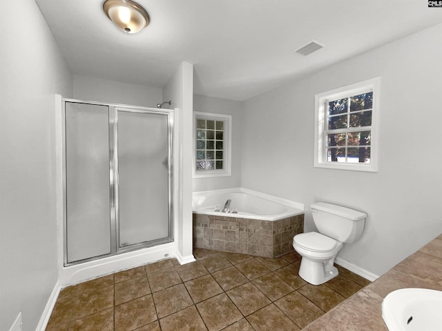 full bathroom with vanity, tile patterned floors, toilet, and separate shower and tub