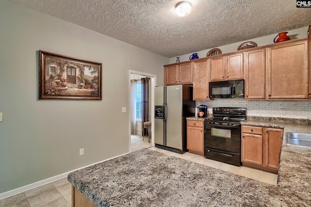 kitchen with sink, black appliances, a textured ceiling, light tile patterned floors, and backsplash