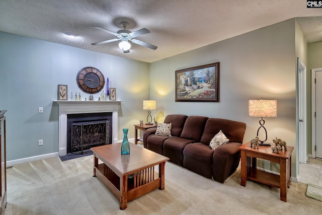 carpeted living room with a textured ceiling and ceiling fan