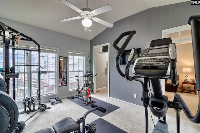 workout room with vaulted ceiling, light carpet, and ceiling fan