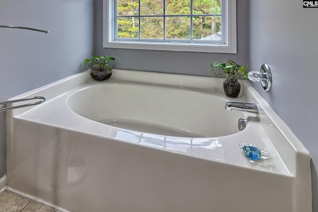 bathroom featuring tile patterned floors and a bathtub