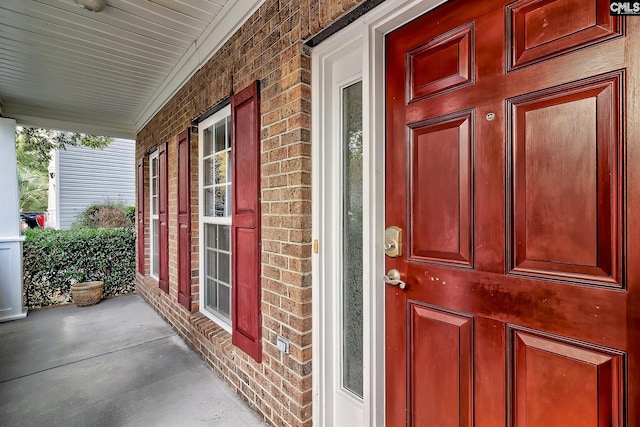 doorway to property featuring a porch