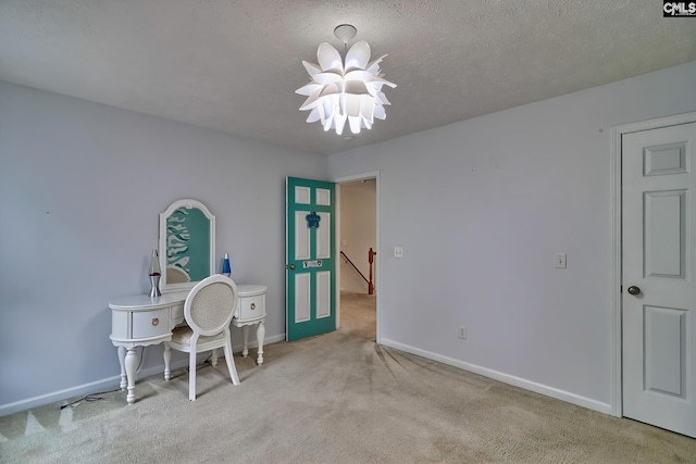 carpeted home office with a textured ceiling