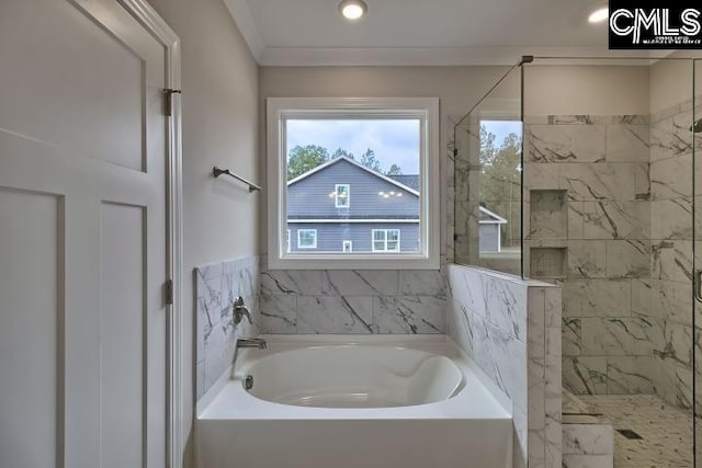 bathroom featuring crown molding and shower with separate bathtub