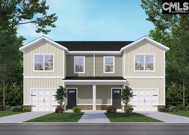 view of front of home featuring a garage and a front yard