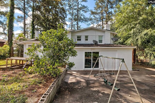 back of house featuring a patio