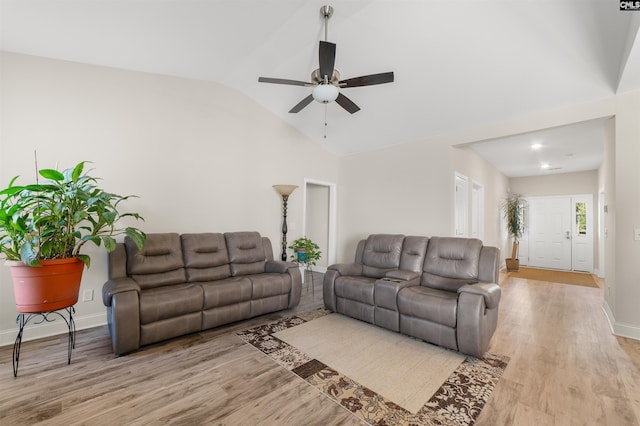 living room featuring light wood-type flooring, lofted ceiling, and ceiling fan