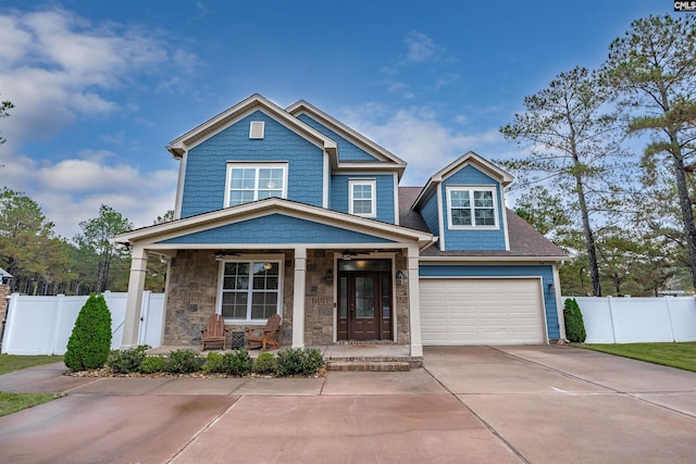 craftsman-style house with a garage and covered porch