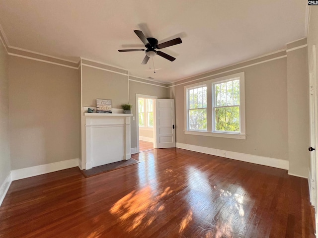 unfurnished living room featuring ceiling fan, crown molding, and dark hardwood / wood-style flooring