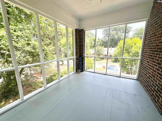 unfurnished sunroom with a wealth of natural light