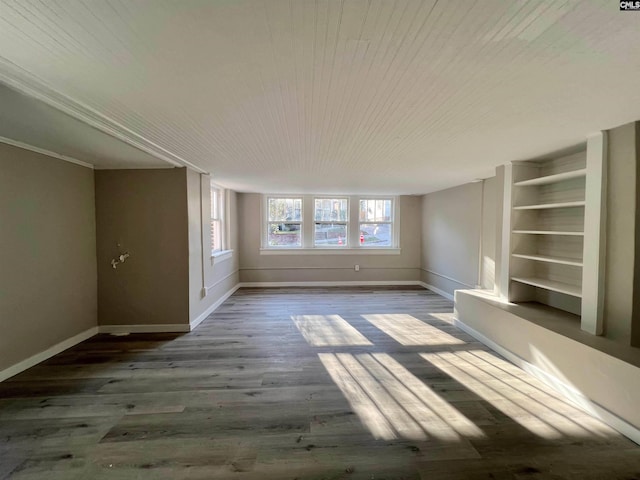 unfurnished living room with wood-type flooring