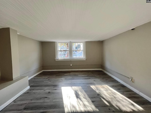 unfurnished room featuring dark hardwood / wood-style floors