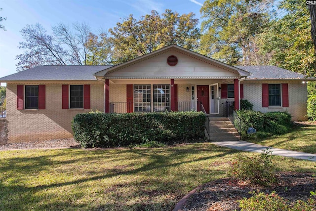 view of front of home featuring covered porch and a front yard