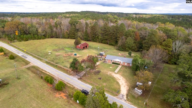 birds eye view of property with a rural view