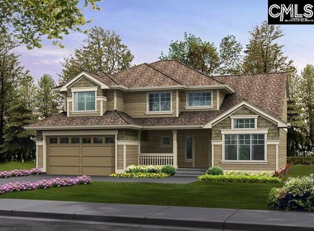 view of front of home featuring a garage and a front yard