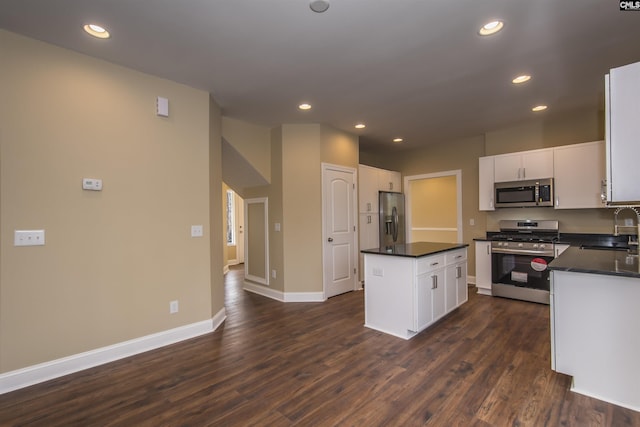 kitchen with sink, white cabinetry, a center island, and stainless steel appliances