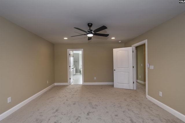 carpeted empty room featuring ceiling fan