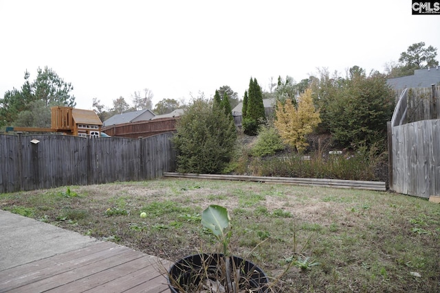 view of yard featuring a wooden deck