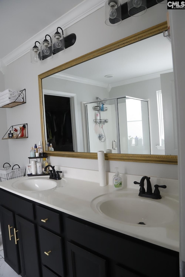 bathroom with a shower with door, vanity, and crown molding