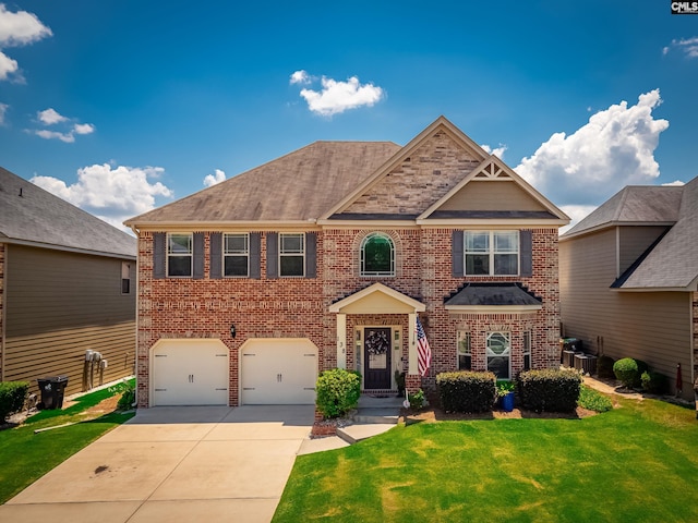 view of front facade featuring a garage, cooling unit, and a front yard