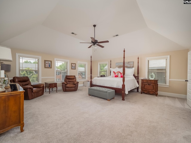 carpeted bedroom featuring multiple windows, lofted ceiling, and ceiling fan